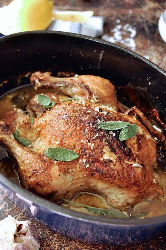 Close up of Jamie Oliver's Chicken in Milk in a casserole pot, fresh out of the oven ready for serving.
