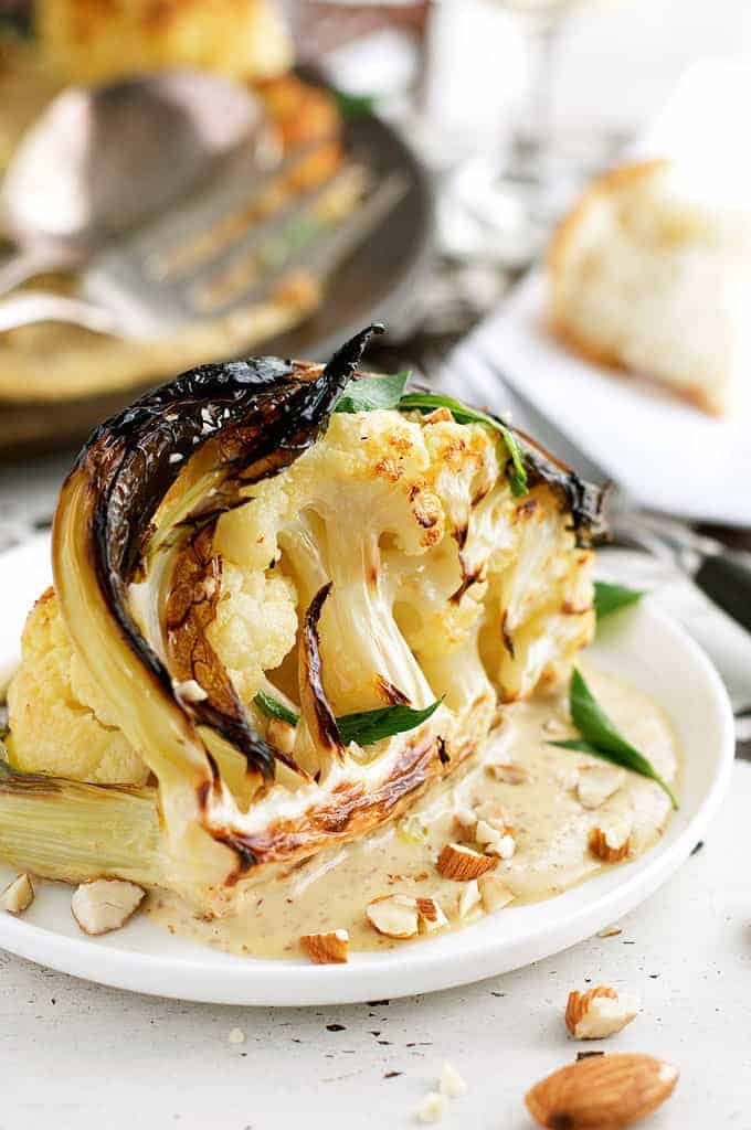 Ester's Roasted Cauliflower with Almond Sauce on white plate
