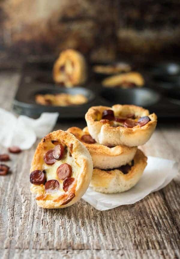 Garlic Bread Mini Pizza - made from plain sandwich bread brushed with garlic butter, these mini pizzas taste like a cross between garlic bread and pizza!