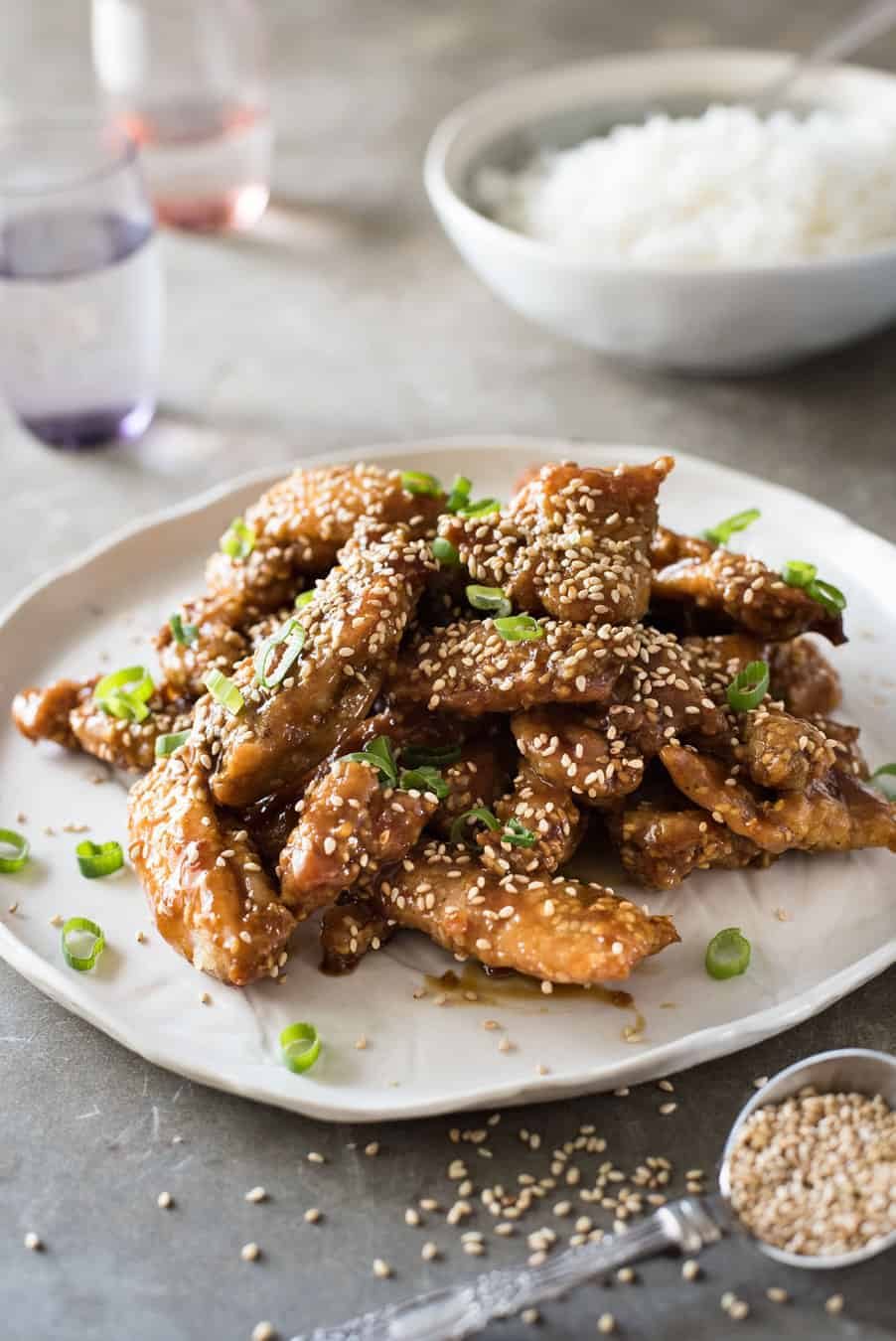 Easy Chinese Honey Sesame Chicken - BAKED, not deep fried, this chicken is coated in a gorgeous sticky irresistible sauce!