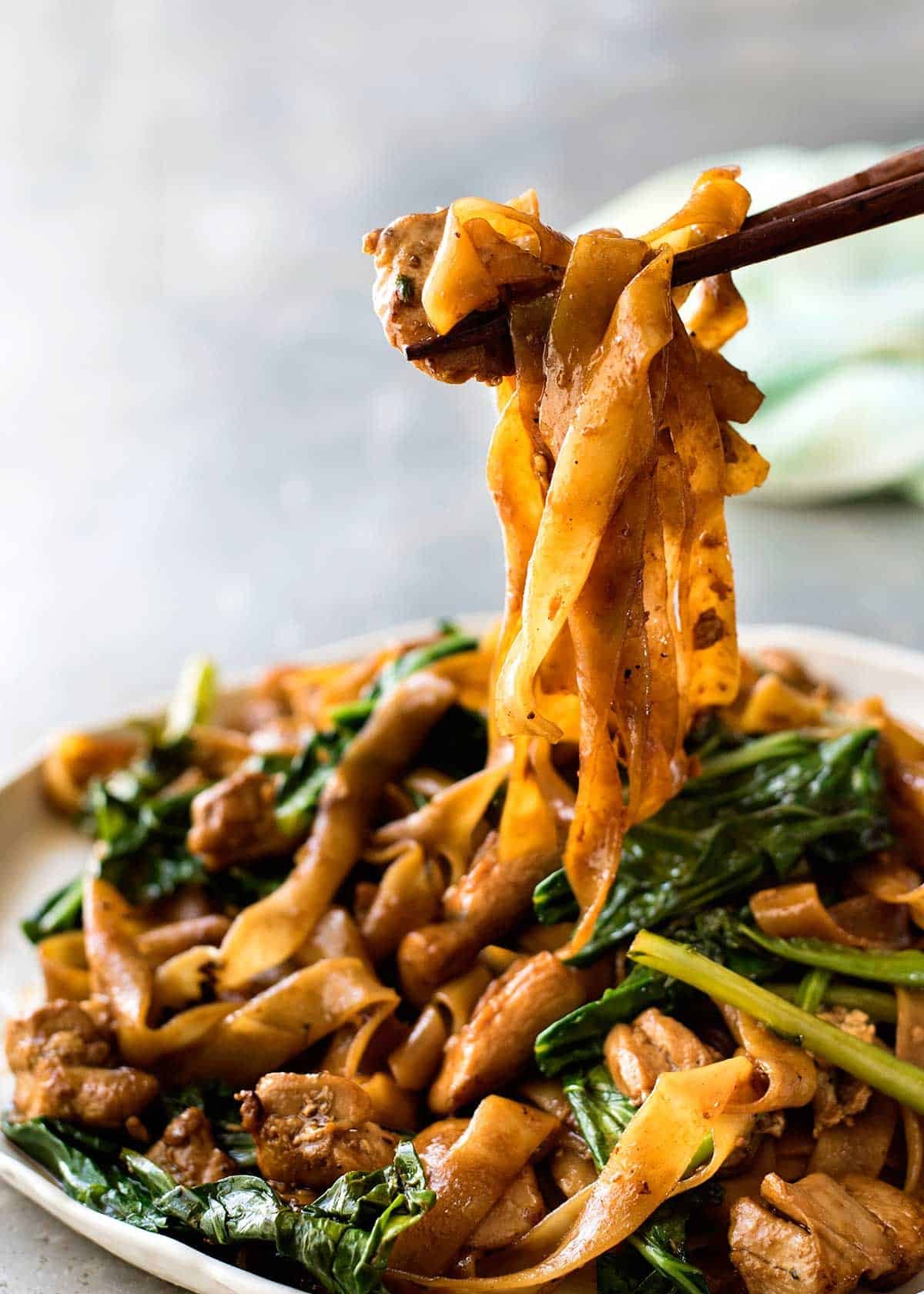 Chopsticks pulling up Pad See Ew