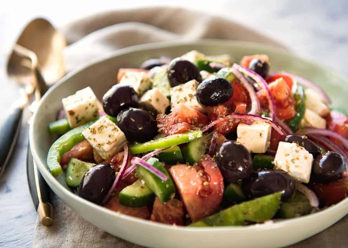 A classic Greek Salad with plump olives and a beautiful homemade Greek Salad Dressing. www.recipetineats.com