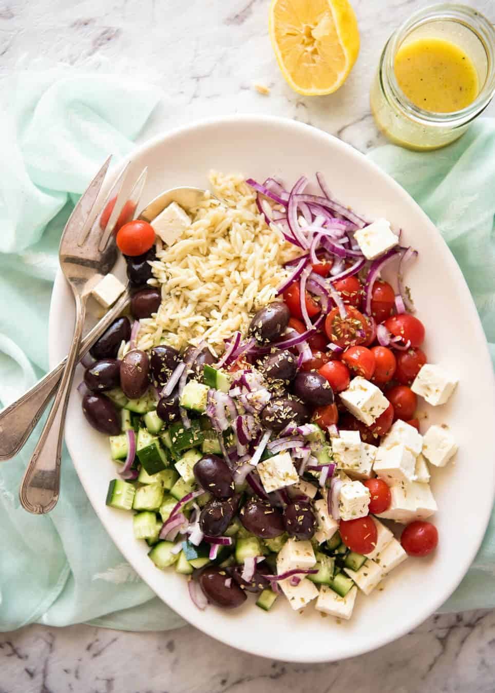 Greek Lemon Orzo Salad (Risoni) - All the fixings of a Greek Salad tossed through orzo / risoni and dressed with a gorgeous zesty lemon vinaigrette. www.recipetineats.com