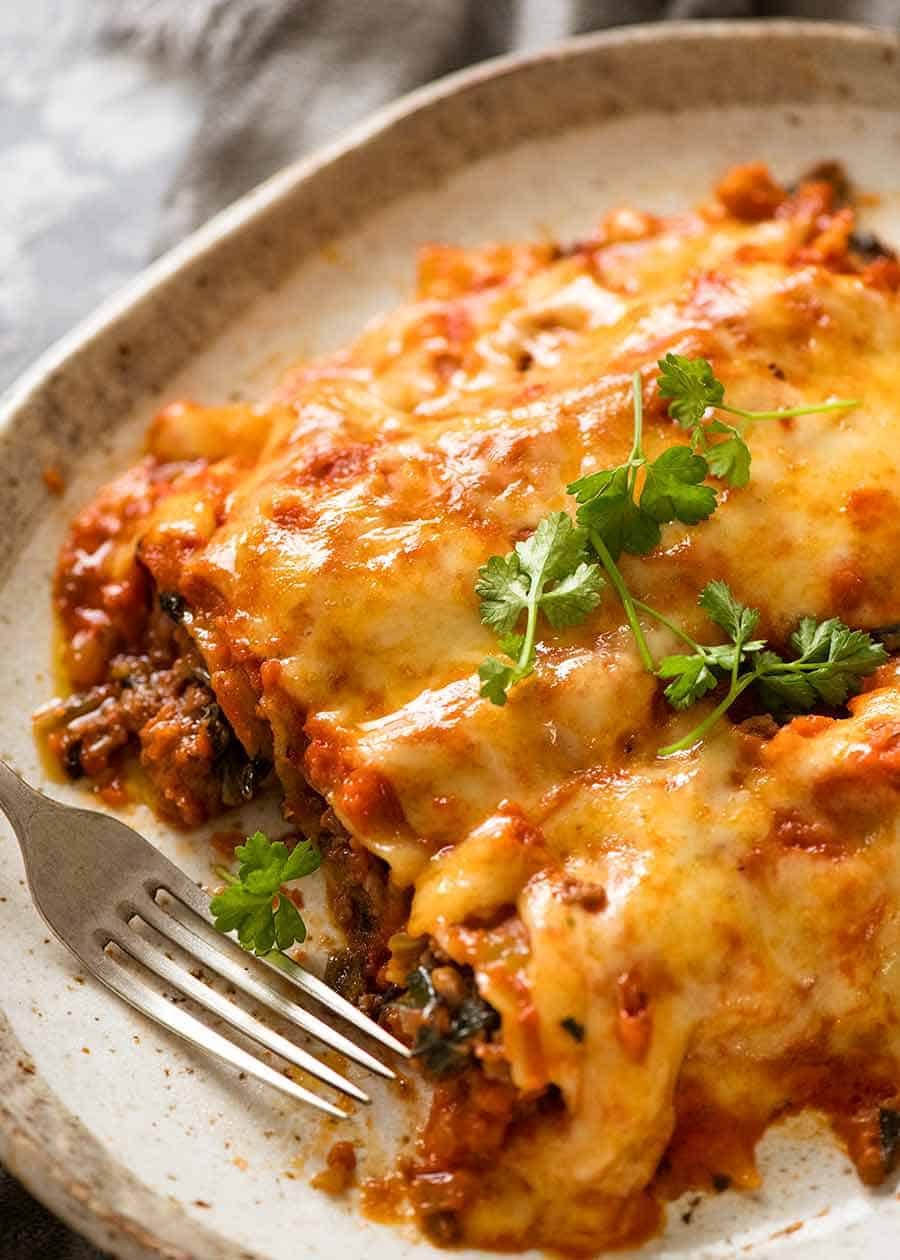 3 Spinach Beef Cannelloni on a plate, ready to be eaten
