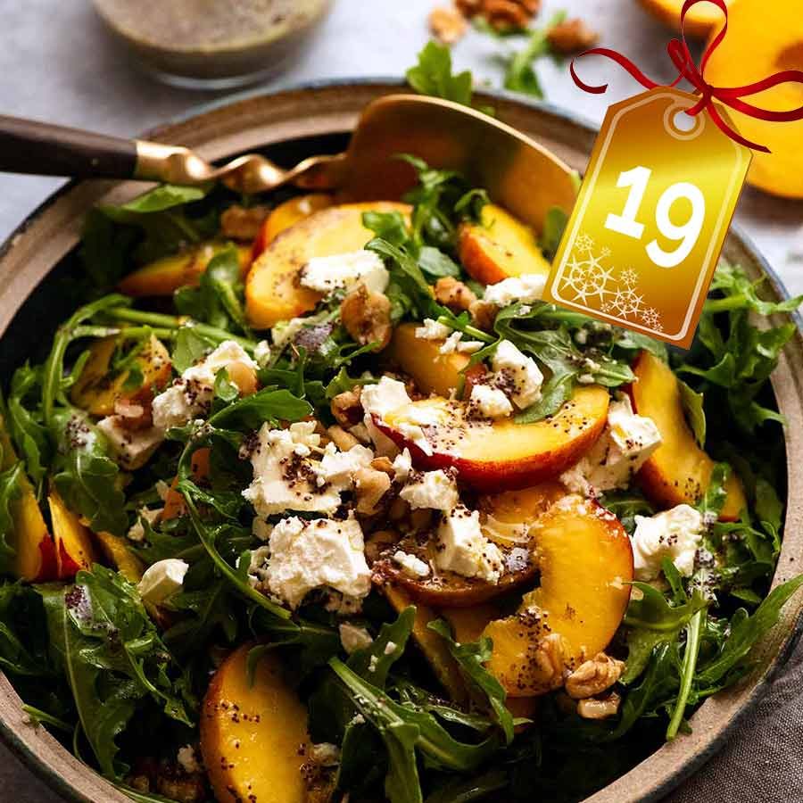 Peach Salad with Poppyseed Dressing in a bowl, ready to be served